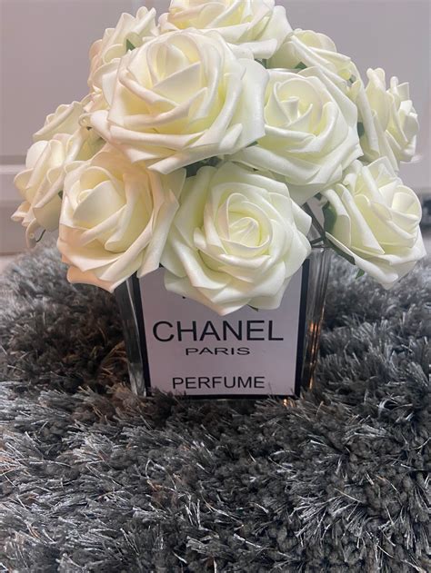 camelia rose chanel|Chanel vase with flowers.